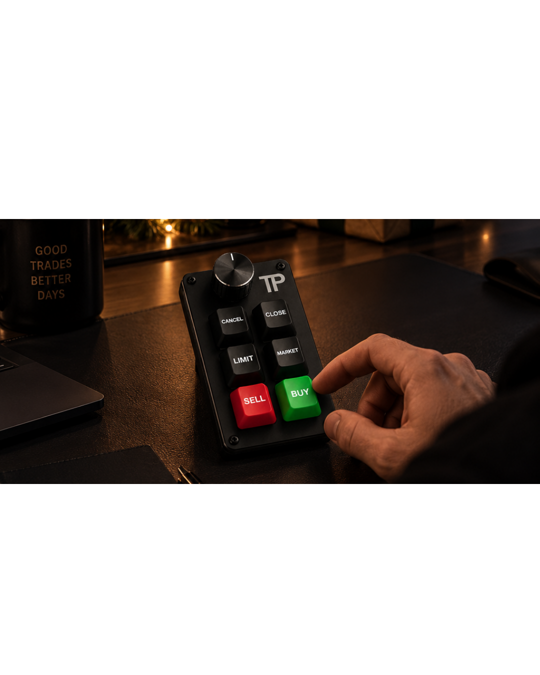 A finger pressing the green BUY key on the TP keyboard